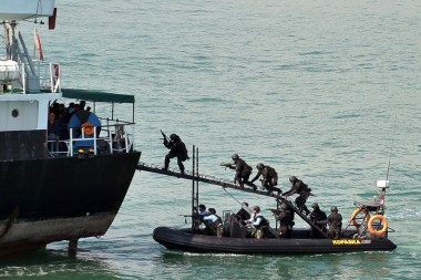 Indonesian troops storm a 'hijacked' vessel during a military simulation, off the Batam Island in Indonesia, in 2012.
