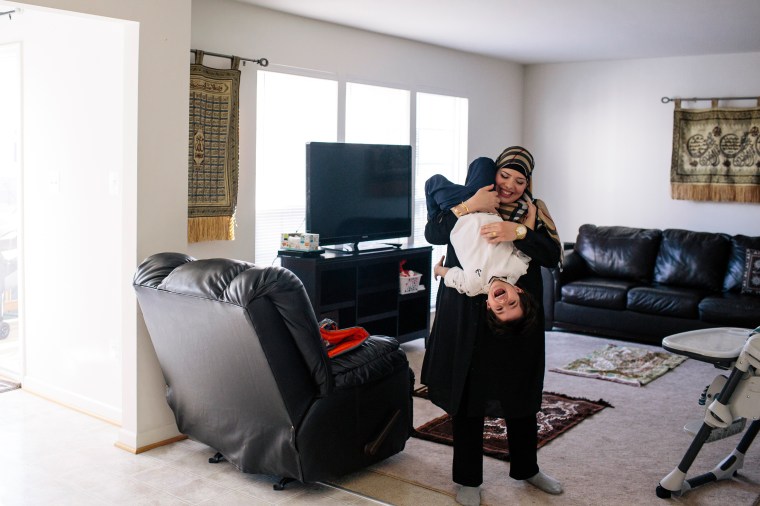 Yazmin Ali plays with her son Karam Kady at their home in Fredericksburg, Va., on Dec. 19, 2015.