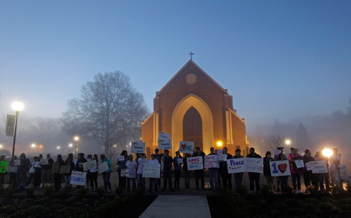 Protesters outside a church at Lenior-Rhyne University before a rally for Donald Trump in Hickory, N.C. on March 14, 2016.