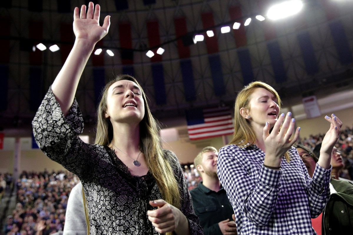 Lesley Chambers and Brensley Baker sing before Donald Trump arrives at Liberty University in Lynchburg, Va. on Jan. 18, 2016.