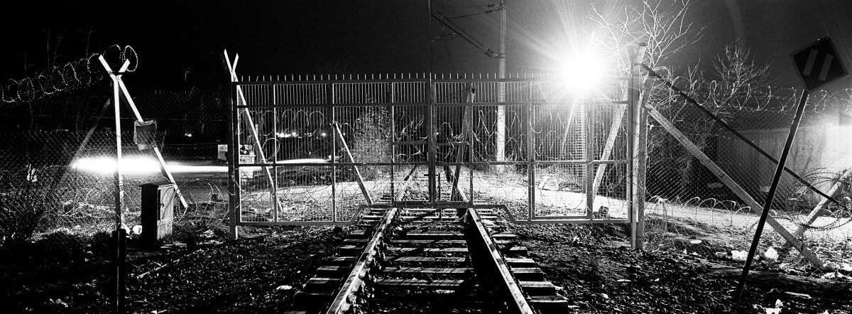 A closed gate of the railway passage at the Greek-Macedonian border next to a refugee camp near the village of Idomeni.
