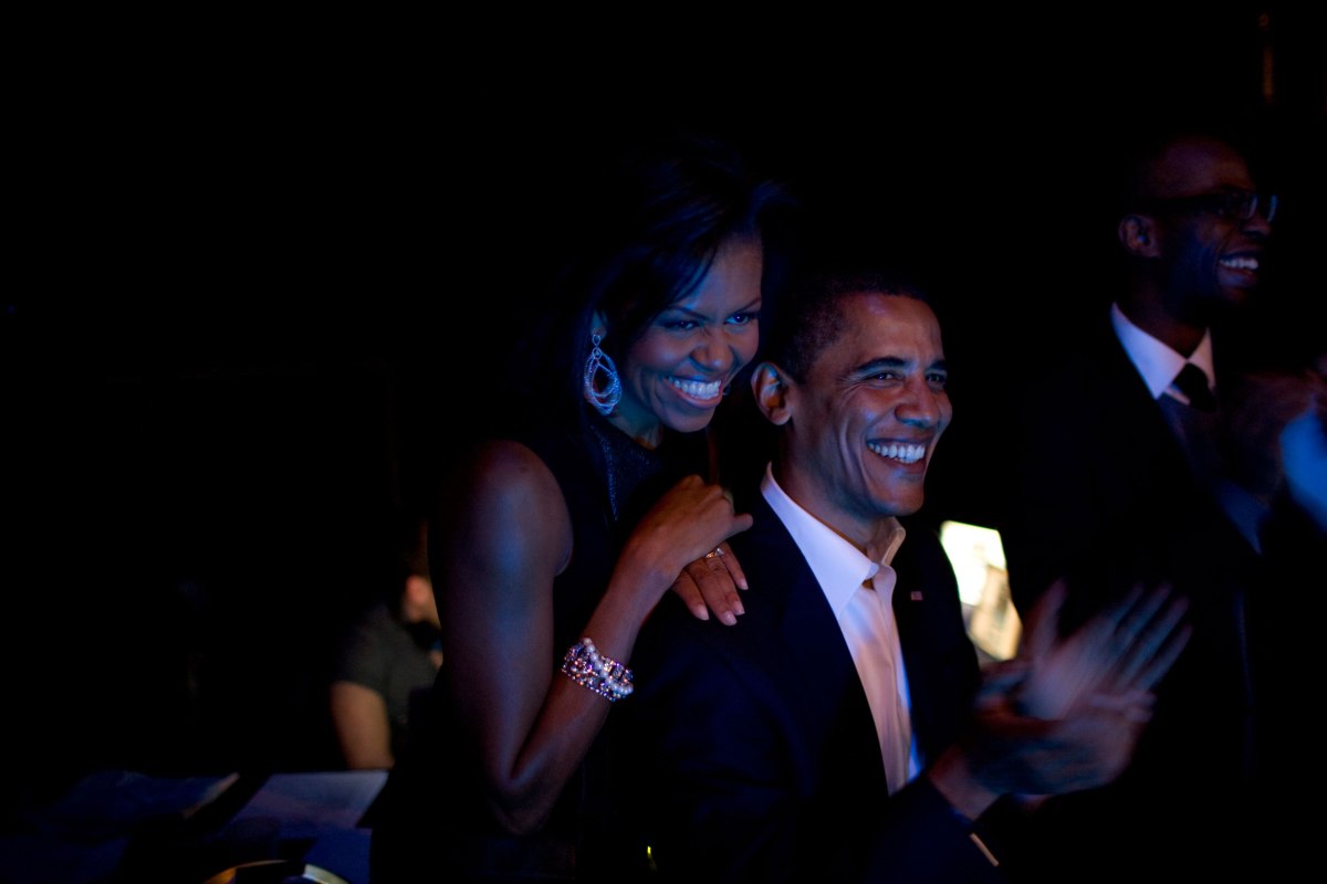 Barack Obama and Michelle Obama listen backstage to a concert by Bruce Springsteen and Billy Joel at Hammerstein Theater in New York City, Oct. 17, 2008.