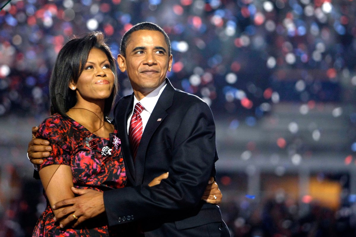 Barack Obama, hugs Michelle Obama after giving his acceptance speech at the Democratic National Convention at Invesco Field at Mile High in Denver, Aug. 28, 2008.