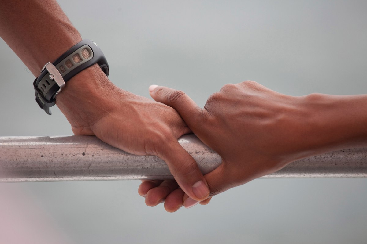 Barack Obama and Michelle ObamaâÂÂs hands rest on the railing of a boat during their tour of St. Andrews Bay in Panama City Beach, Fla., Aug. 15, 2010.