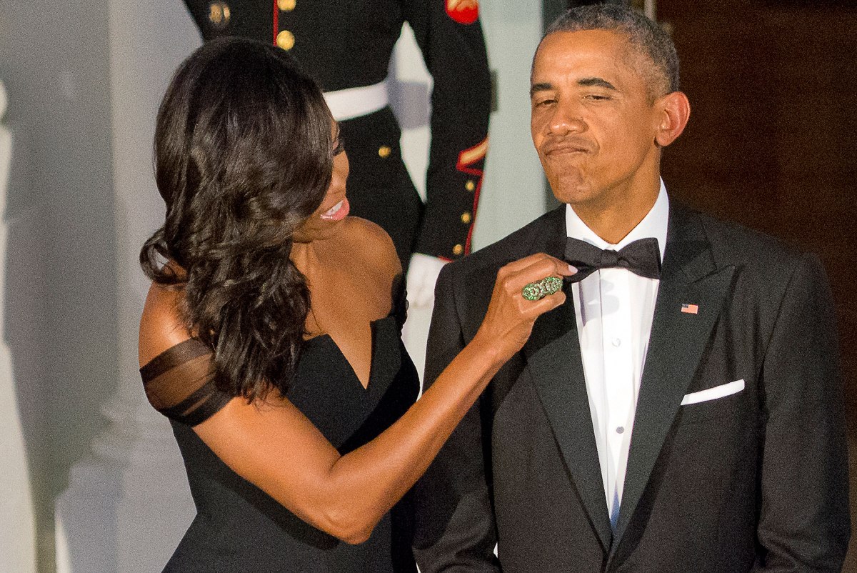 Michelle Obama adjusts the tie of Barack Obama as they prepare to welcome President XI Jinping of China and Madame Peng Liyuan to a State Dinner in their honor on the North Portico of the White House in Washington, D.C., on Sept. 25, 2015.