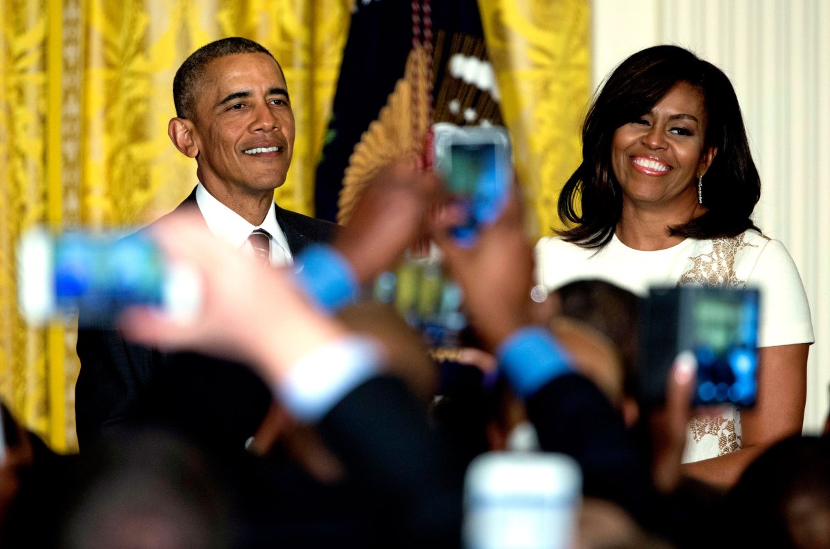 Barack Obama and Michelle Obama are seen above audience member cell phones as they host a reception celebrating African American History Month in the East Room of the White House in Washington, D.C., Feb. 18, 2016.