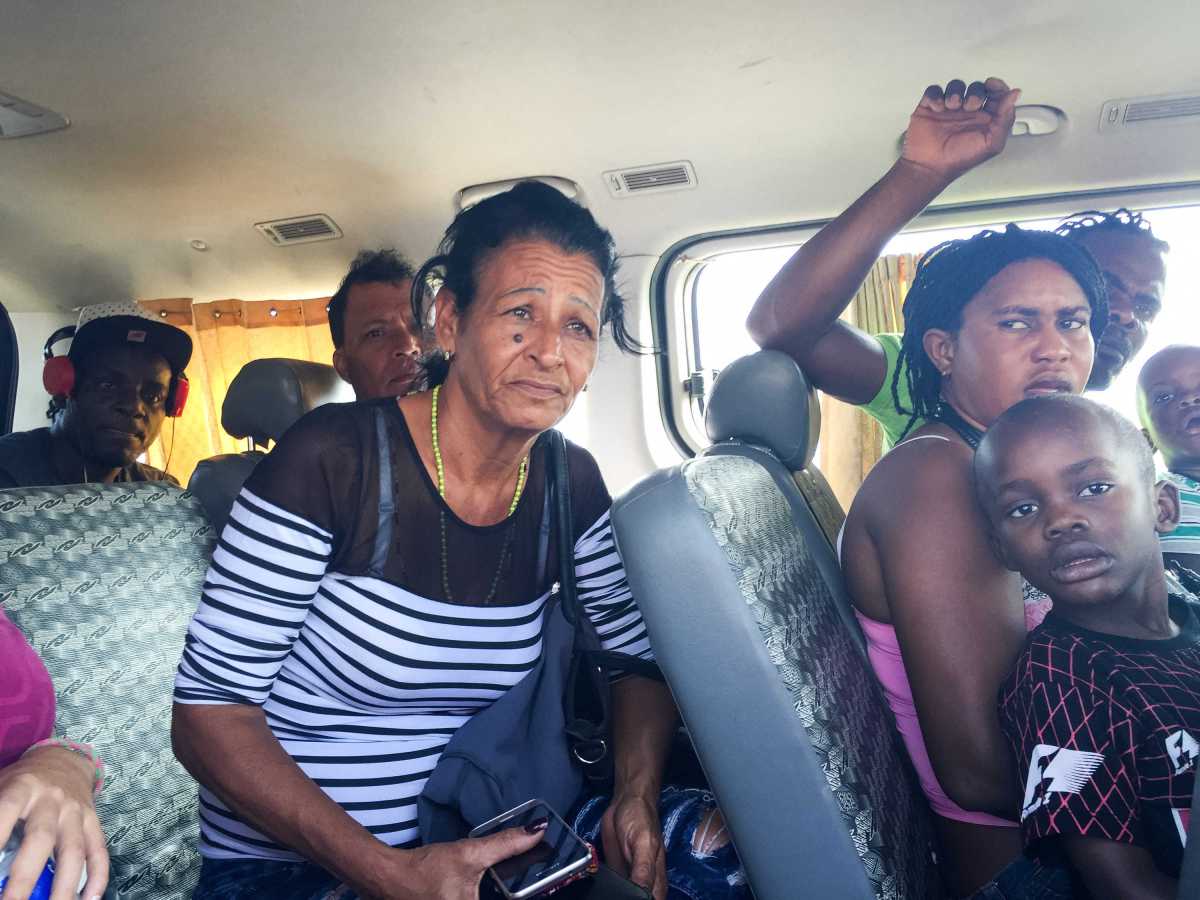 Marta rides in a van with Haitian migrants after being detained by Peruvian migration officials on May 24. They were released after an officer took a liking to Liset and decided to let her go.