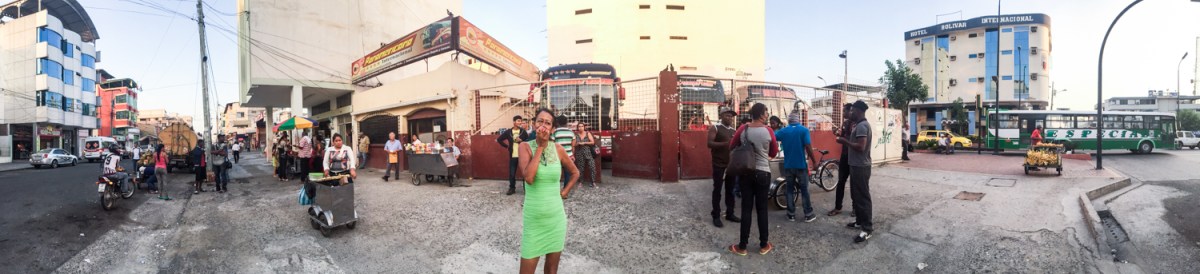 Marta eats an apple at a rest stop in Ecuador on May 25. She and Liset then took a bus with other migrants over night to near the Colombian border.