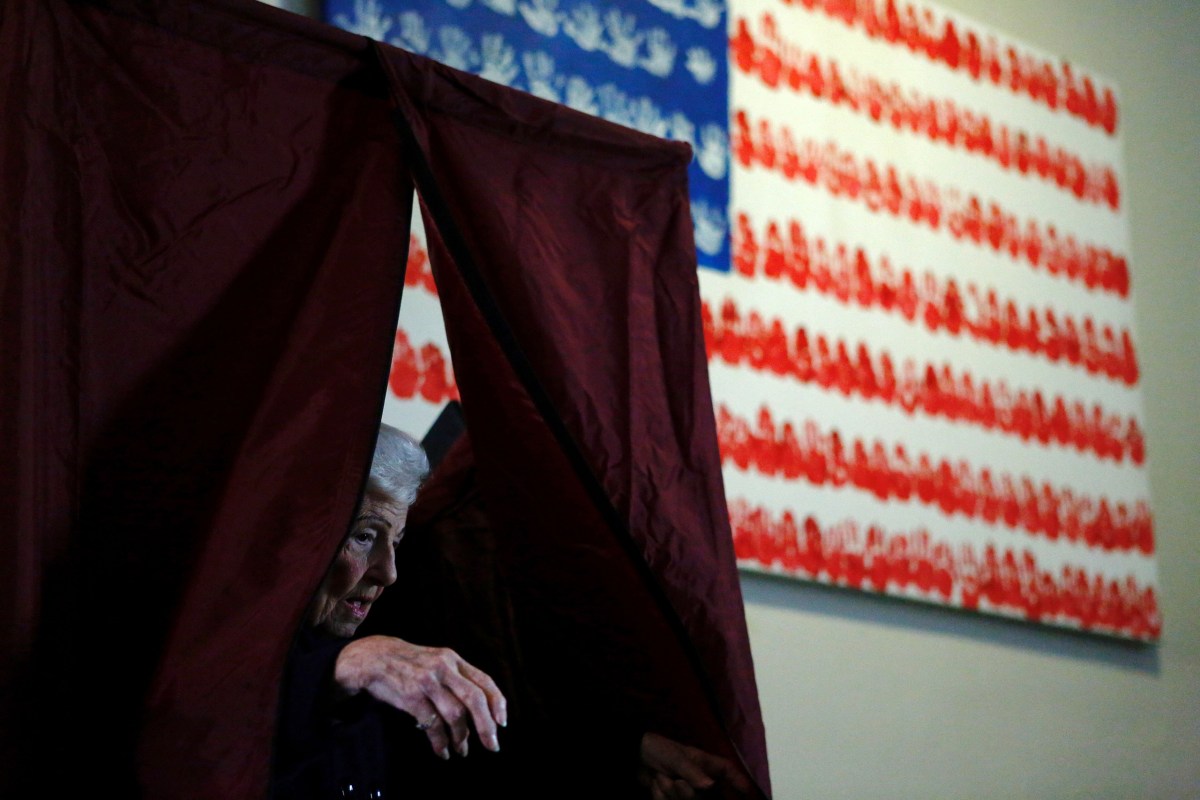 A woman exits a polling station after voting in the presidential election on Nov. 8, 2016. in Newport, New Jersey.