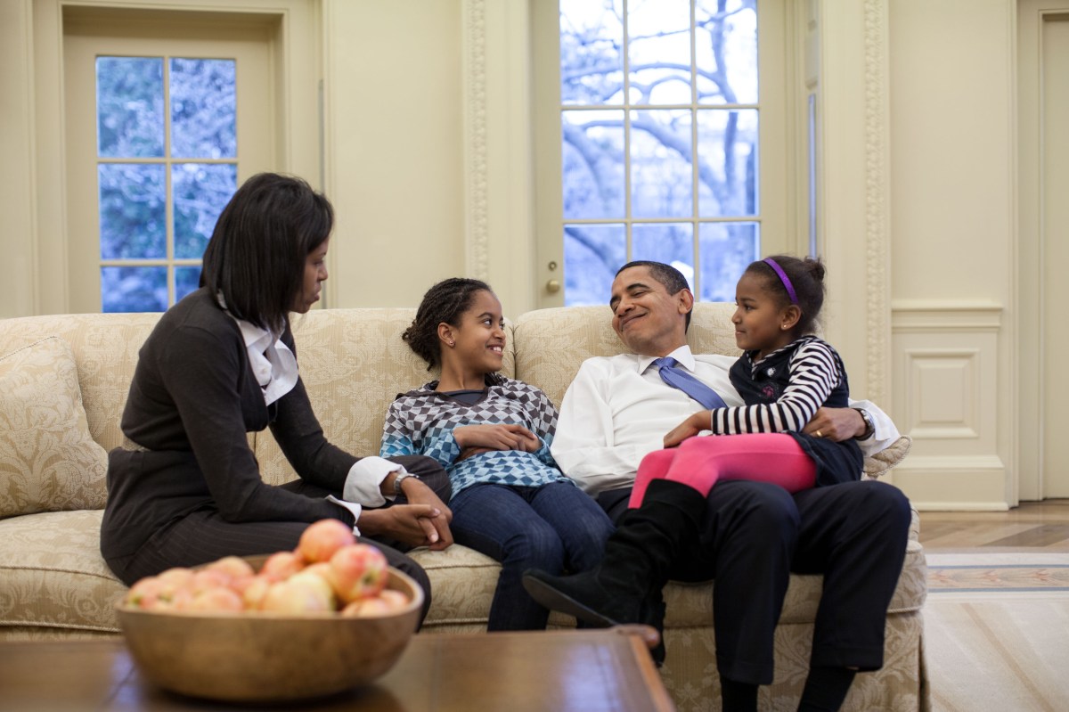 In this official White House photograph, President Barack Obama, First Lady Michelle Obama and daughters Malia and Sasha sit together in the Oval Office, Feb. 2, 2009.