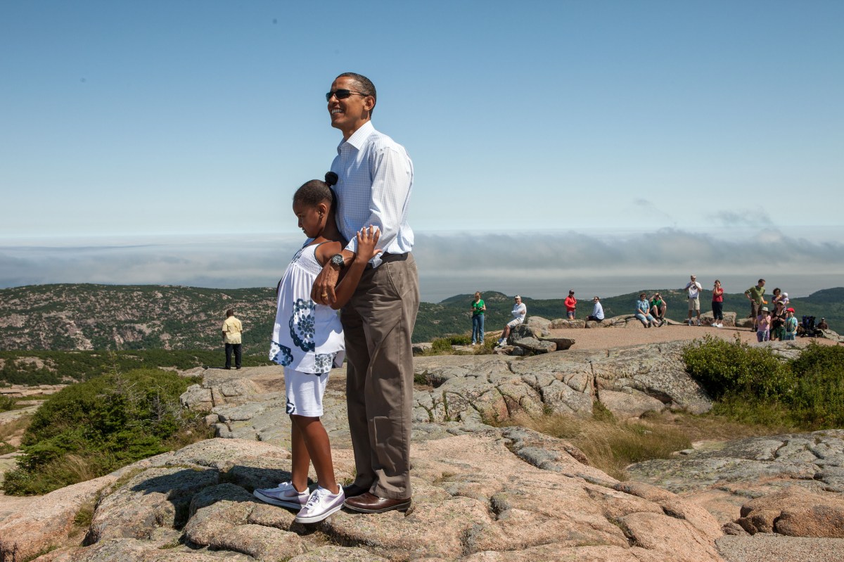In this official White House photograph, President Barack Obama and daughter Sasha stand atop Cadillac Mountain in Acadia National Park, Maine, July 16, 2010.