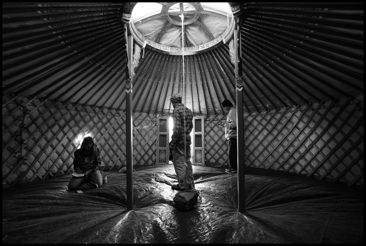 People take cover inside a yurt at the Standing Rock camp in North Dakota on Nov 10, 2016. Protesters have set up teepee and tent camps on land owned by Energy Transfer Partners to slow the progress of construction and have threatened to block the highway.