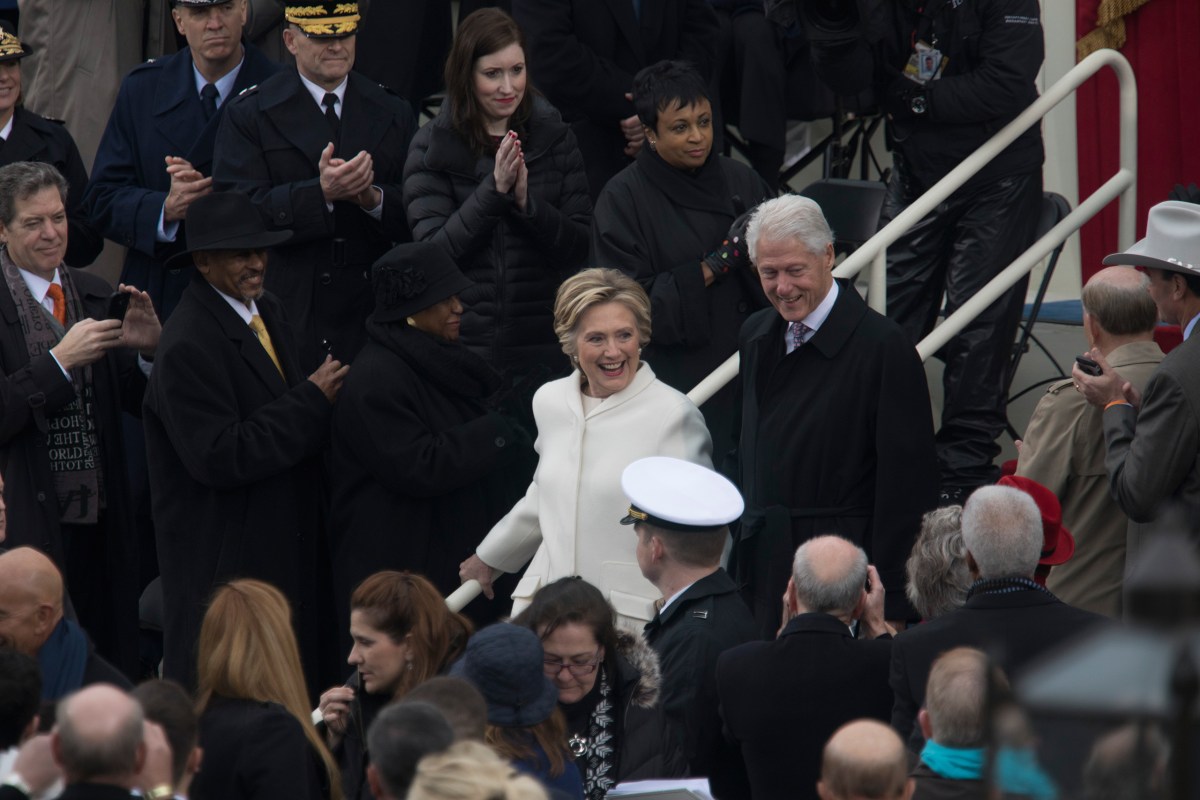 Hillary Clinton, the Democratic nominee who lost the 2016 election to Donald Trump, and former President Bill Clinton arrive on the Capitol stage for the inauguration on Jan. 20, 2017.