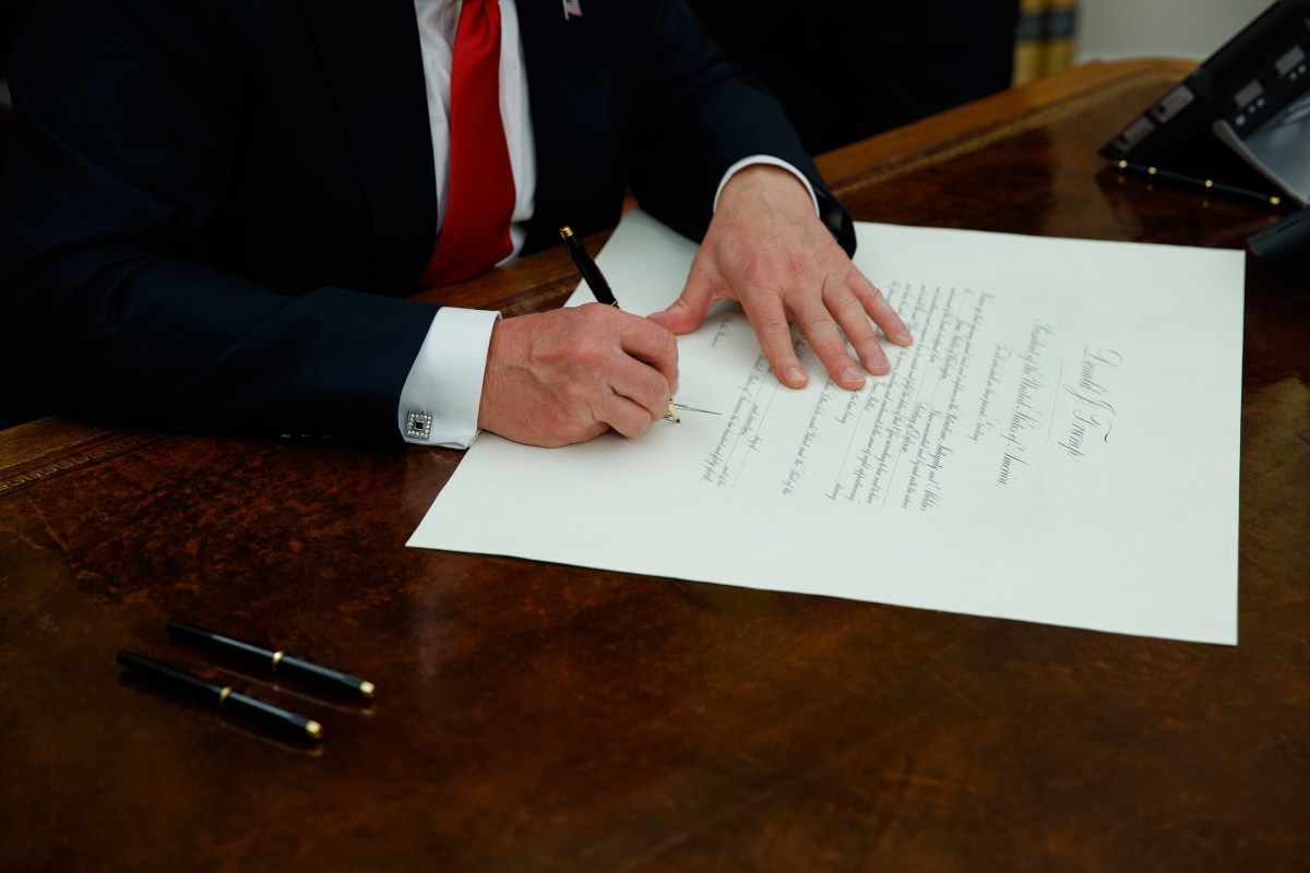 President Donald Trump signs a confirmation for Defense Secretary James Mattis in the Oval Office of the White House in Washington on Jan. 20, 2017.