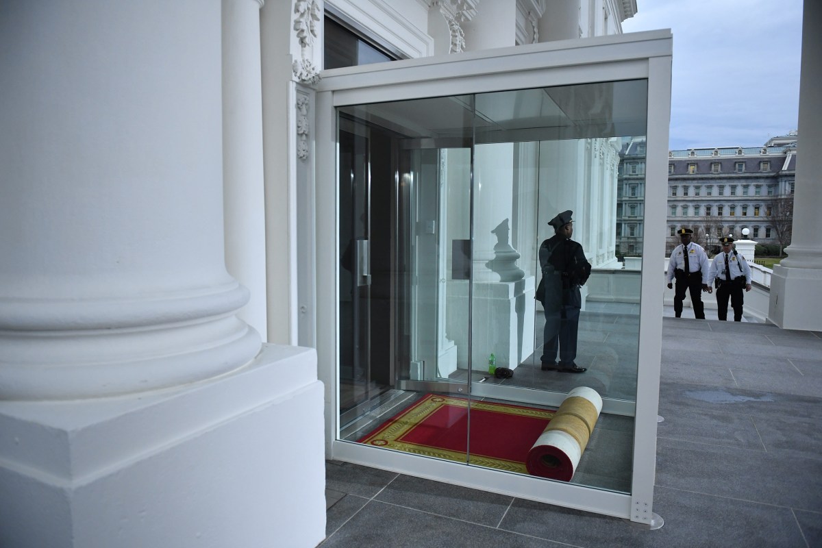 The red carpet sits rolled and waiting for President-elect Donald Trump inside the North Portico of the White House on Jan. 20, 2017.