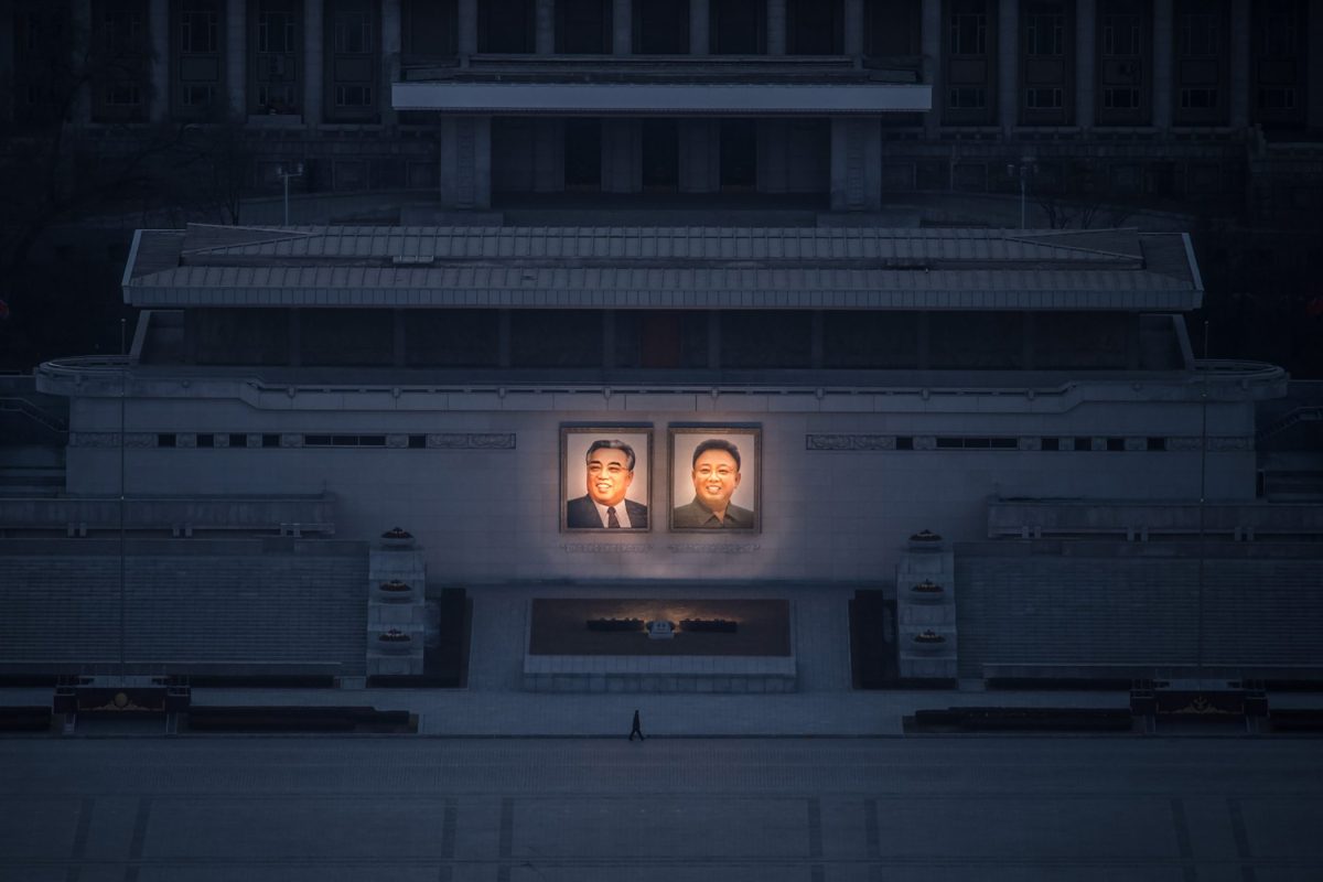 A pedestrian passes portraits of the late Kim Il Sung, left, and Kim Jong Il in Pyongyang on Feb.Ã‚ 17.