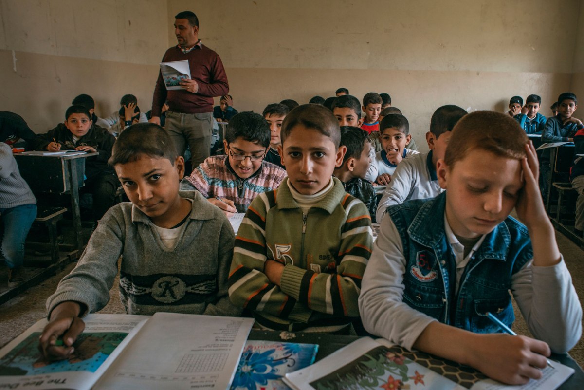 A group of boys during a classroom lesson at the Zahret Al-Mada'en school in eastern Mosul on April 2.