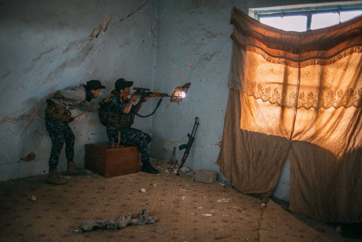 A sniper from the Iraqi Federal Police in the Dawasa neighborhood of Mosul on March 30.