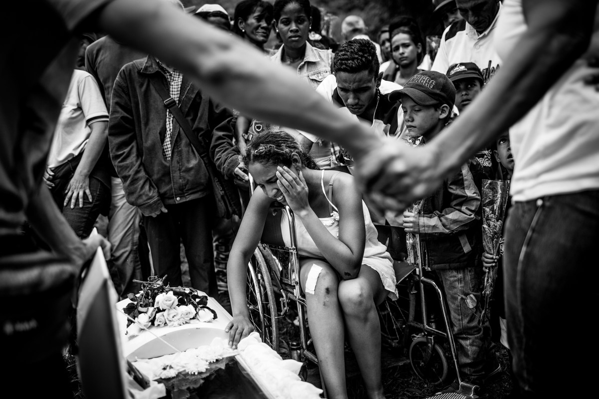 A young boy's funeral after a grenade explosion. Alejandro Cegarra