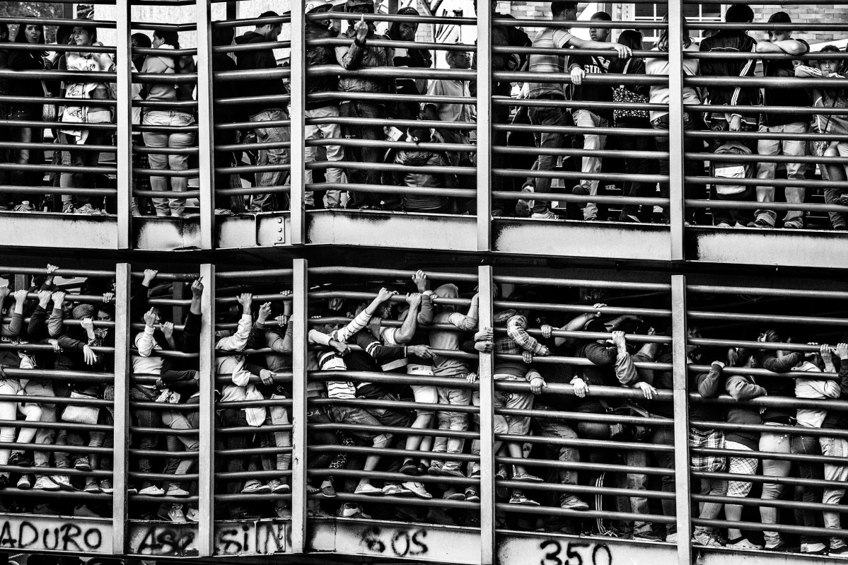 In Los Teques area in the Caracas suburbs hundreads of people wait since early morning hours to try their chance to get any basic products regulated by the government such as oil, sugar, milk or toilet paper. August 2016. Oscar B. CastilloâFractures Collective