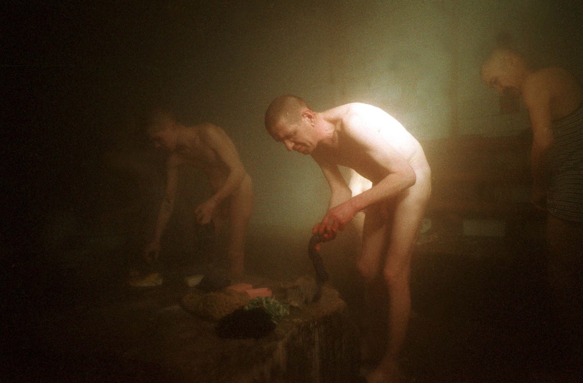 Putin's Russia - The Darkness of Russia March 2001 Siberia The Banya in Colony 33, Mariinsk. Outside temperatures are -35 degrees celsius, causing a constant stream inside where it is rather warm. Stanley Greene—NOOR