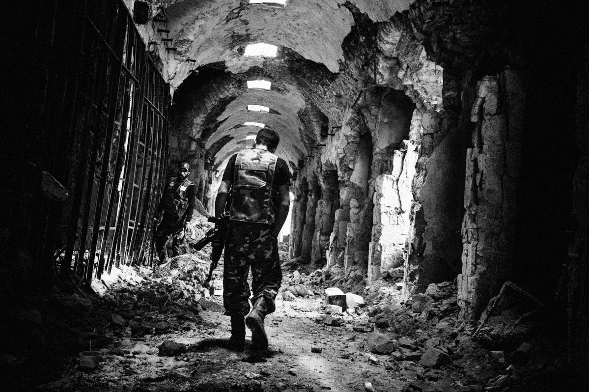 The old souk, a UNESCO heritage site, April 2, 2013. "Who will solve the depths of horrors to defend a sun beam's architecture with his life and carve jungles of despair to hold a mountain heartbeat in his hand."- qoute by E.E. Cummings. Stanley Greene—NOOR