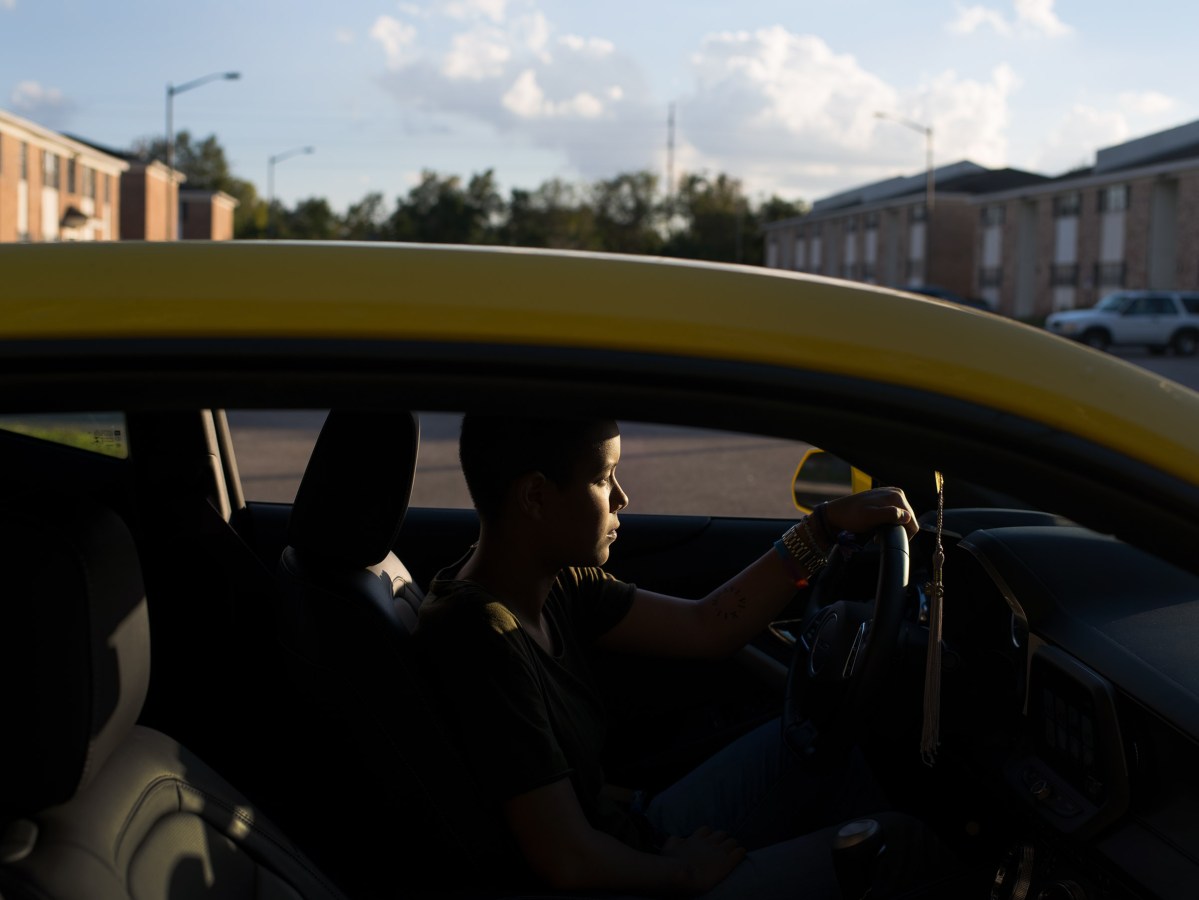 A portrait of Kali in her new Camaro. With part of the One Orlando donations she was able to buy her dream car.