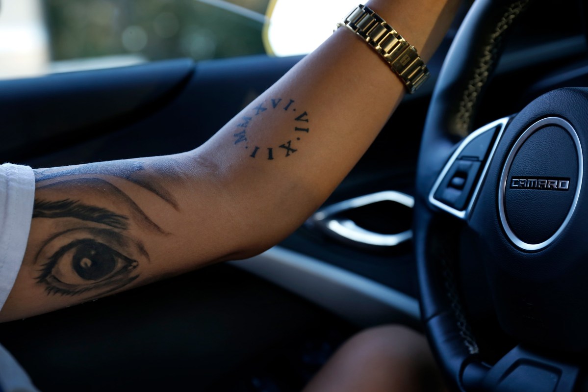 Kali takes a drive on February 12, 2017. She recently had Omar's eye tattooed on her arm. She said, âIâve got to keep moving for him. Live the second life for him.â
