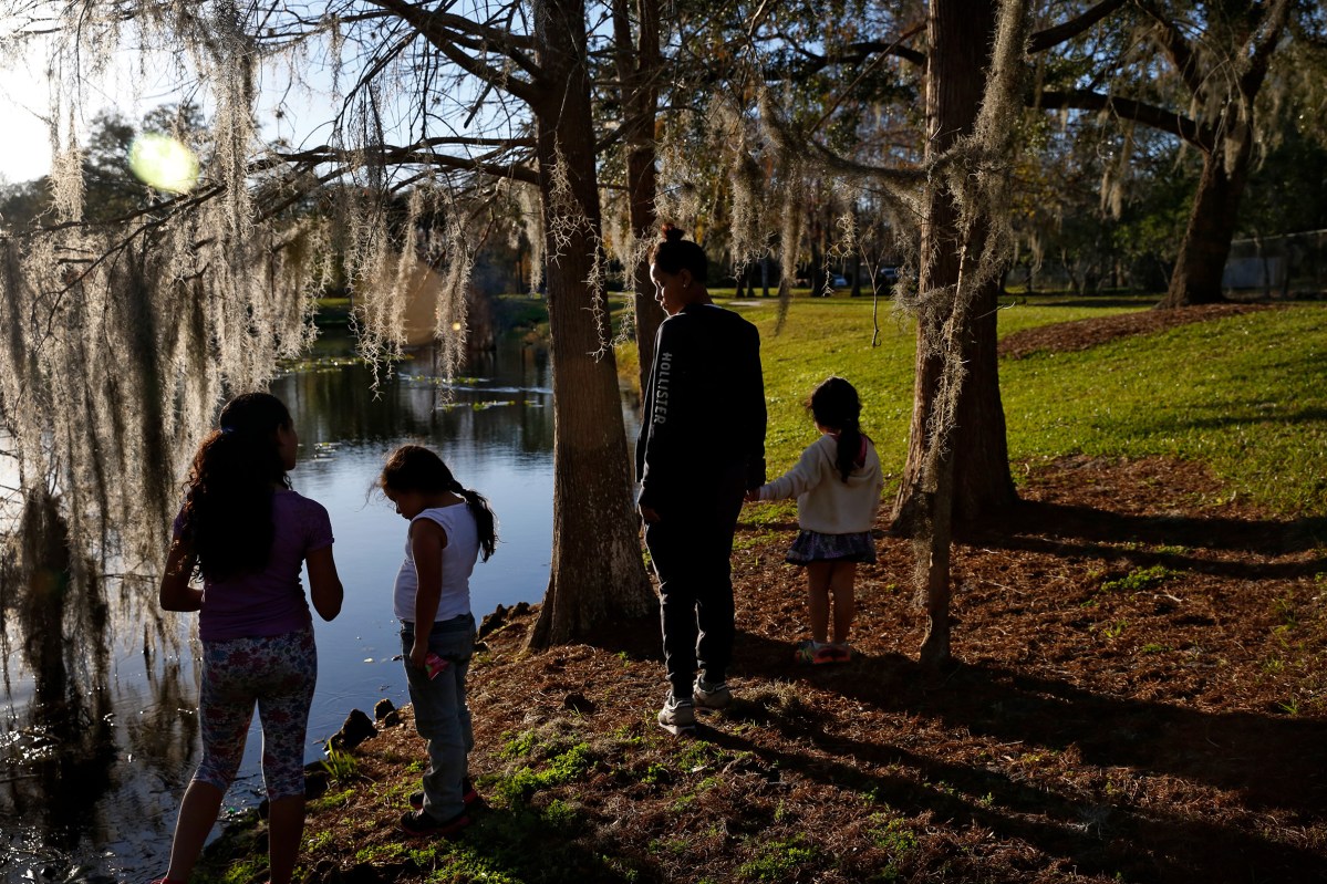 Pulse survivor Kaliesha Andino takes her little sister and neighborhood kids to a park in Orlando, Fla., on Friday, February 10, 2017.