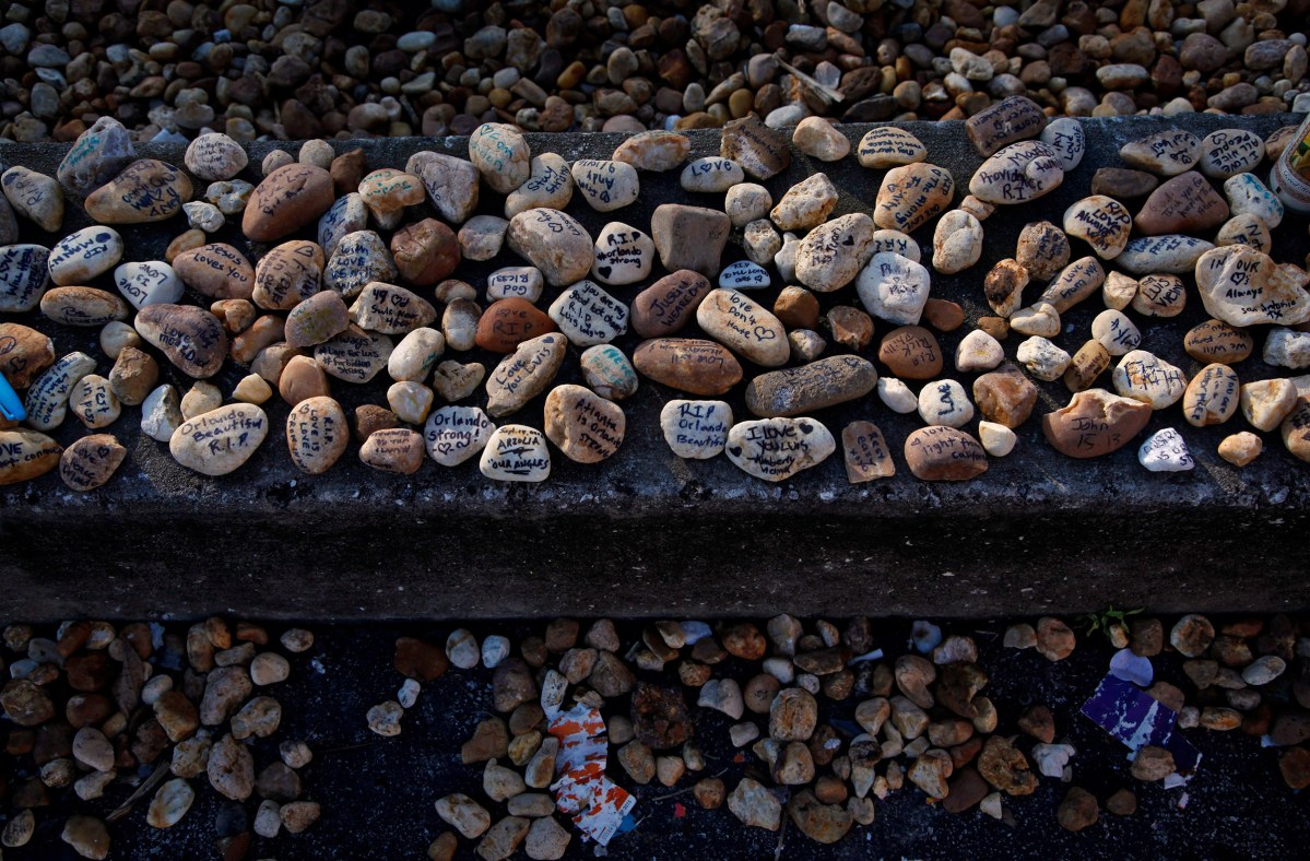 Stones outside Pulse nightclub are turned into tiny memorials by community members leaving written messages on them. Outside the Pulse nightclub in Orlando, Fla