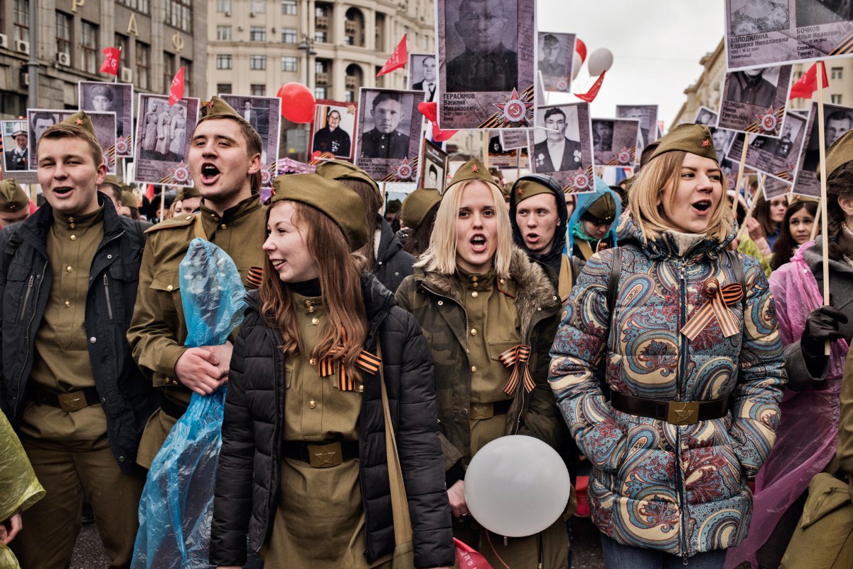 Young patriots carry portraits of World War II soldiers during the annual Victory Day march, marking the anniversary of the 1945 defeat of Nazi Germany, Moscow, May 9, 2017.