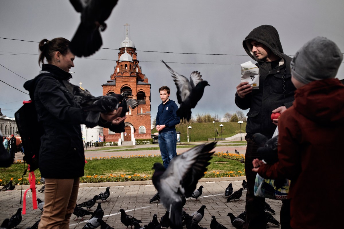 Born in 2000, the year Russian President Vladimir Putin first came to power, Mikhail (center), represents a generation that Russians have taken to calling “Putin’s Children.” The speech he gave at an anti-Putin demonstration in March got him in trouble at school in his hometown of Vladimir, Russia. Pictured in May 2017 in Vladimir, he says he still plans to join the next protest, which is scheduled for June 12.