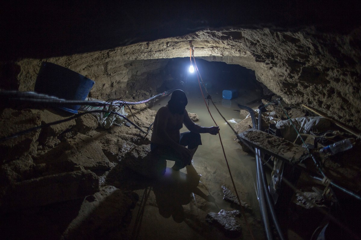 Thirty five meters under the ground, a Palestinian smuggler is trying to pull water out of a tunnel, which is linking Gaza with Egypt, after it was flooded with sea water by the Egyptian Authoriites in Rafah in southern Gaza, October 2, 2015.
