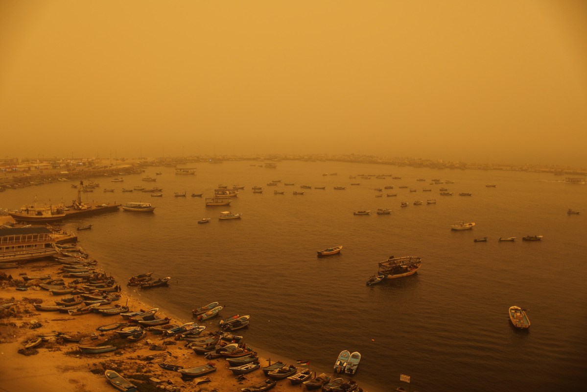 A sand storm shrouds the Gaza strip, Tuesday, Sept. 8, 2015. An unseasonal sandstorm hit many countries in the Middle East with a blanket of yellow dust on Tuesday, sending hundreds of people to hospitals with breathing difficulties and causing the deaths of two women, officials said.