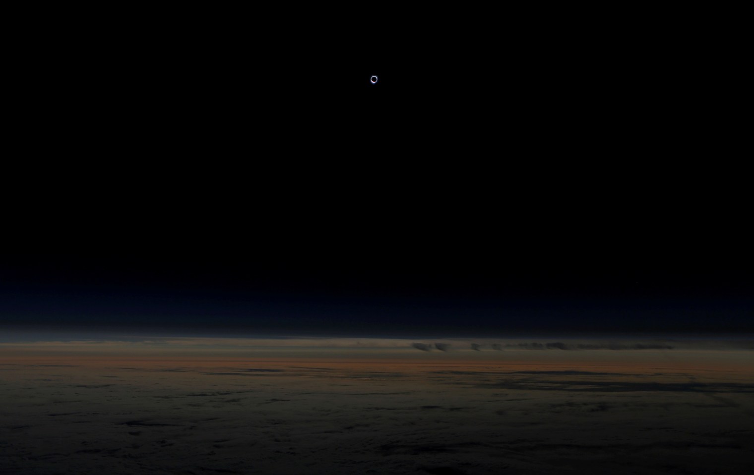 The sun is obscured by the moon during a solar eclipse, as seen from an Alaska Airlines commercial jet at 40,000 feet above the Pacific Ocean, off the coast of Depoe Bay, Ore., on Aug. 21, 2017.