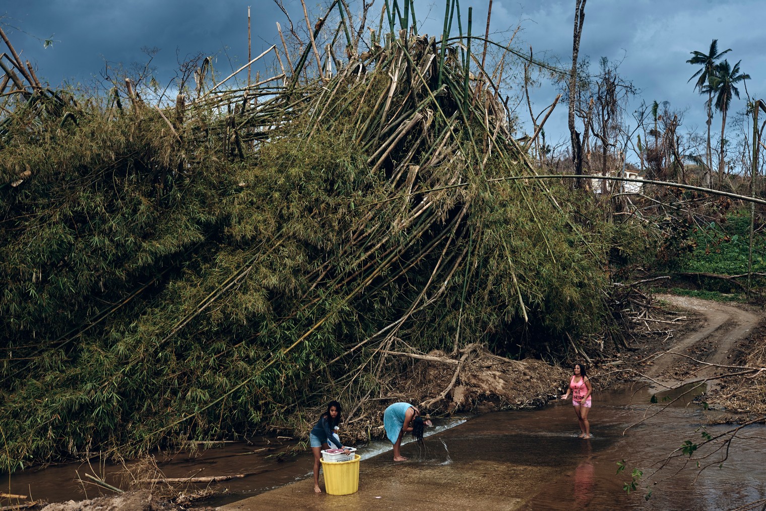 A family bathes in a river in Morovis, Puerto Rico, on Oct. 1, 2017.
