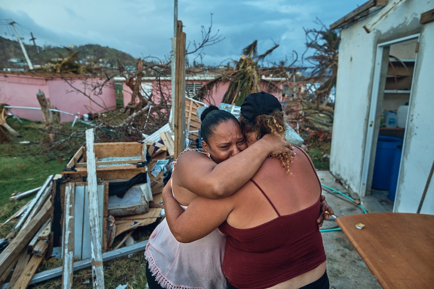 Sheila Sustache, 37, cries and hugs her aunt Yasmin Morales Torres, 41, after seeing the damage to their houses in Yabucoa, Puerto Rico, on Sept. 29, 2017.