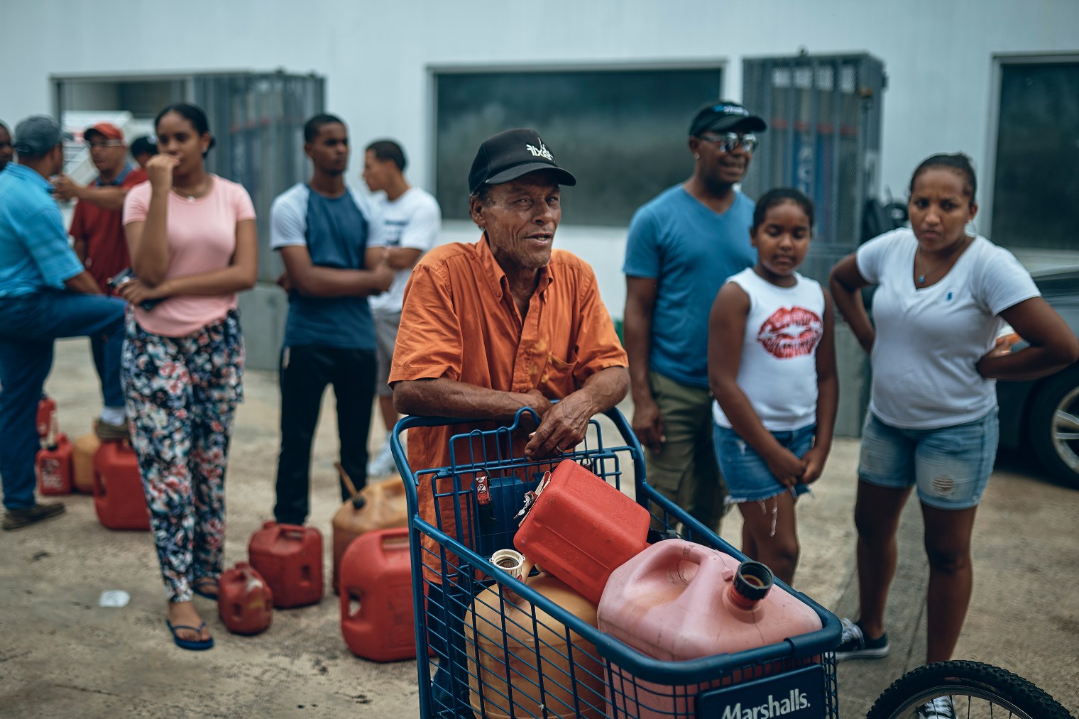 People wait in line to get fuel from a gas station in San Juan, Puerto Rico, on Sept. 30, 2017.