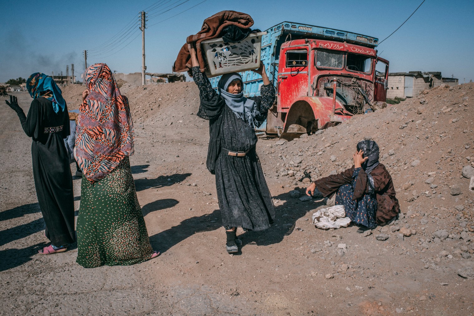 Civilians return to Raqqa to collect some of their belongings, which they left behind while fleeing the fighting between Syrian Democratic Forces and the Islamic State, on Oct. 18.