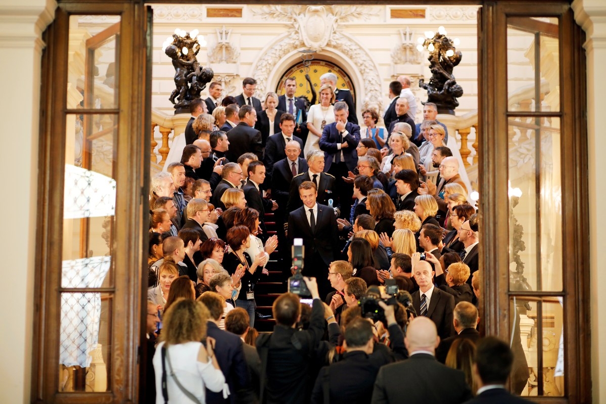 Macron, center, leaves FranceâÂÂs Lyonà prefecture on Sept.à 28
