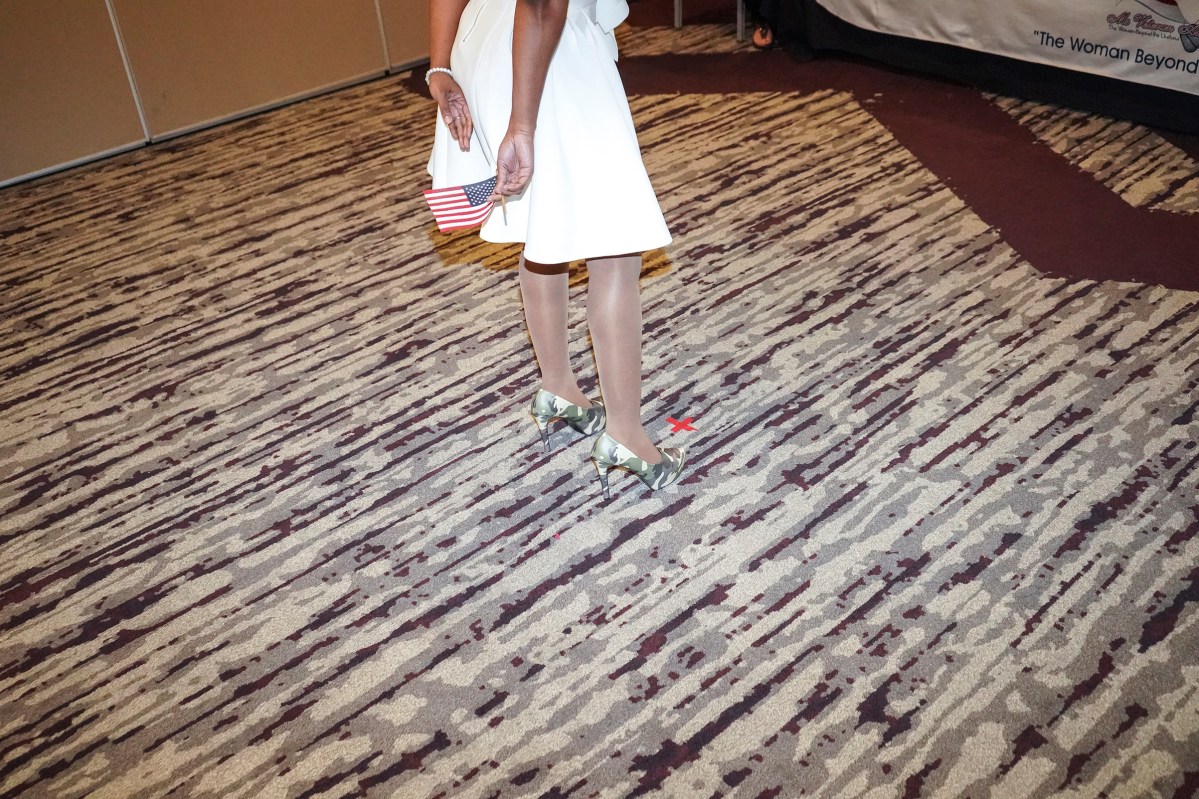 2017. Washington DC. USA. A contestant in camouflage high heels during the preliminary judging. Ms. Veteran America is a pageant for active duty and retired female members of the armed forces. Part beauty pageant, part talent competition, part test of strength and commitment, the event raises funds for Final Salute, an organization providing housing and support for homeless women veterans and their children. Some of the participants danced and some sang, but many gave testimonials of sexual assault, PTSD and homelessness. Lindsay Gutierrez won the 2017 competition. The keynote speaker was the original "Daisy Duke", Catherine Bach.