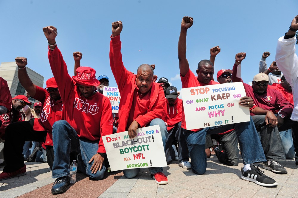 Protesters rally for former quarterback Colin Kaepernick outside an NFL game between the Detroit Lions and the Arizona Cardinals in Detroit on Sept. 10, 2017.