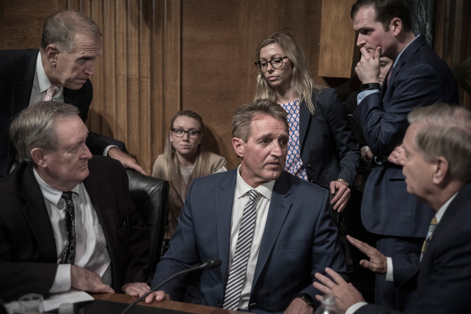 Jeff Flake, center, listens to fellow GOP Senator Lindsey Graham, right, on Sept. 28, moments after Flake called for a delay in Brett KavanaughÃ¢Â€Â™s Supreme Court confirmation