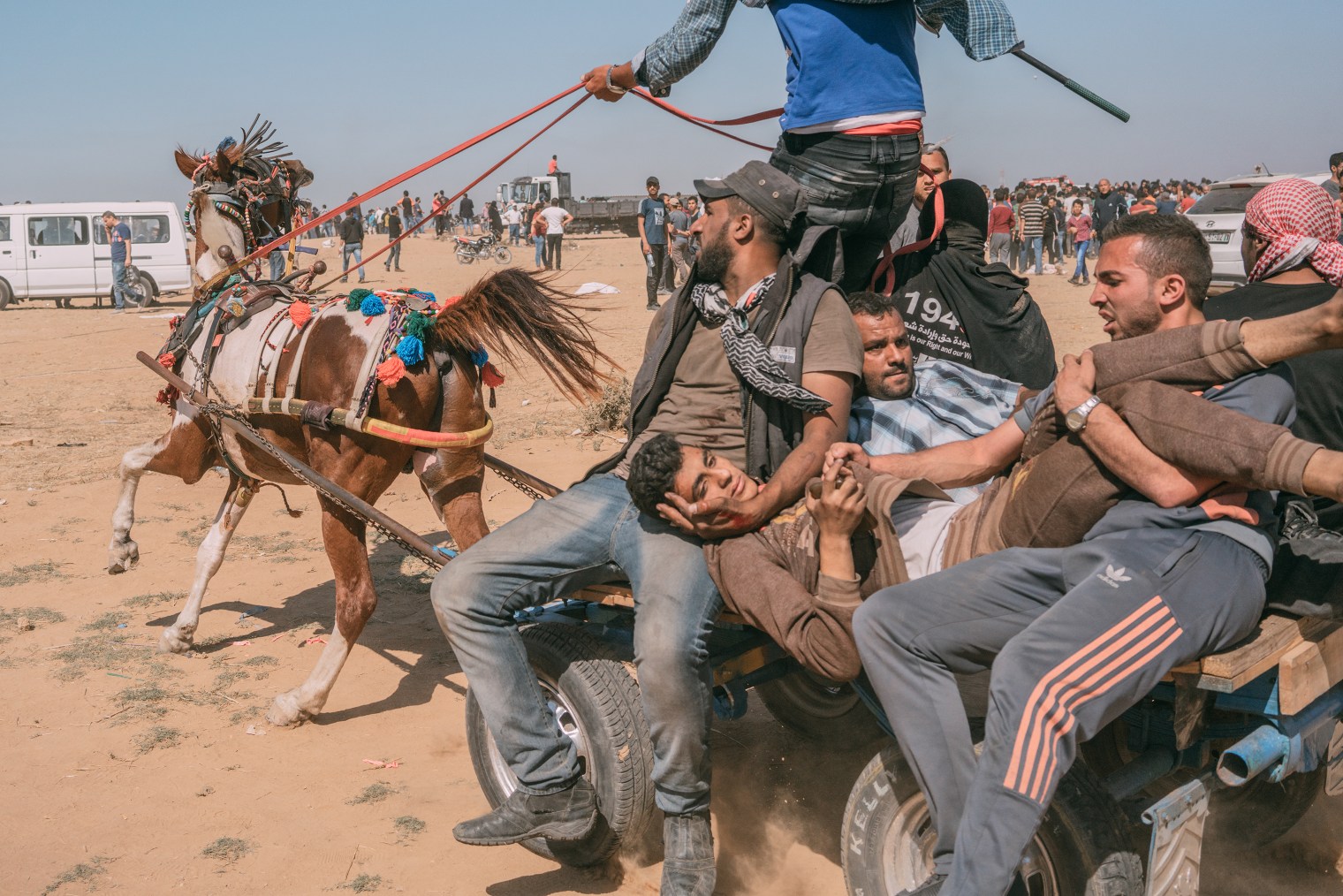 As the U.S. opened a new embassy in Jerusalem on May 14, violence erupted just miles away at the Gaza border, where Israeli soldiers clashed with Palestinian protesters like this injured man, who was evacuated by horse cart.
