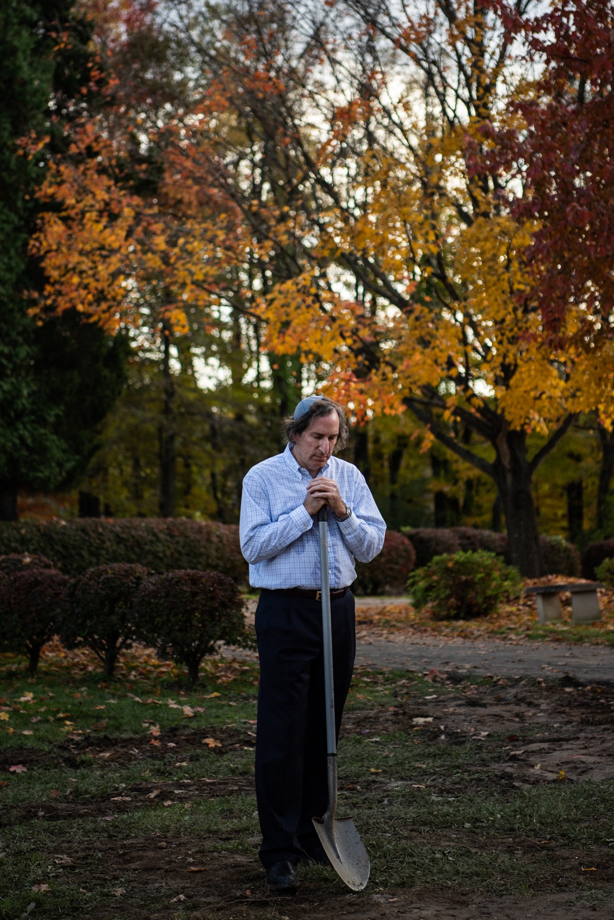 Gene Tabachnick, a friend of the slain brothers David and Cecil Rosenthal, stands near their graves during a burial ceremony in Pittsburgh
